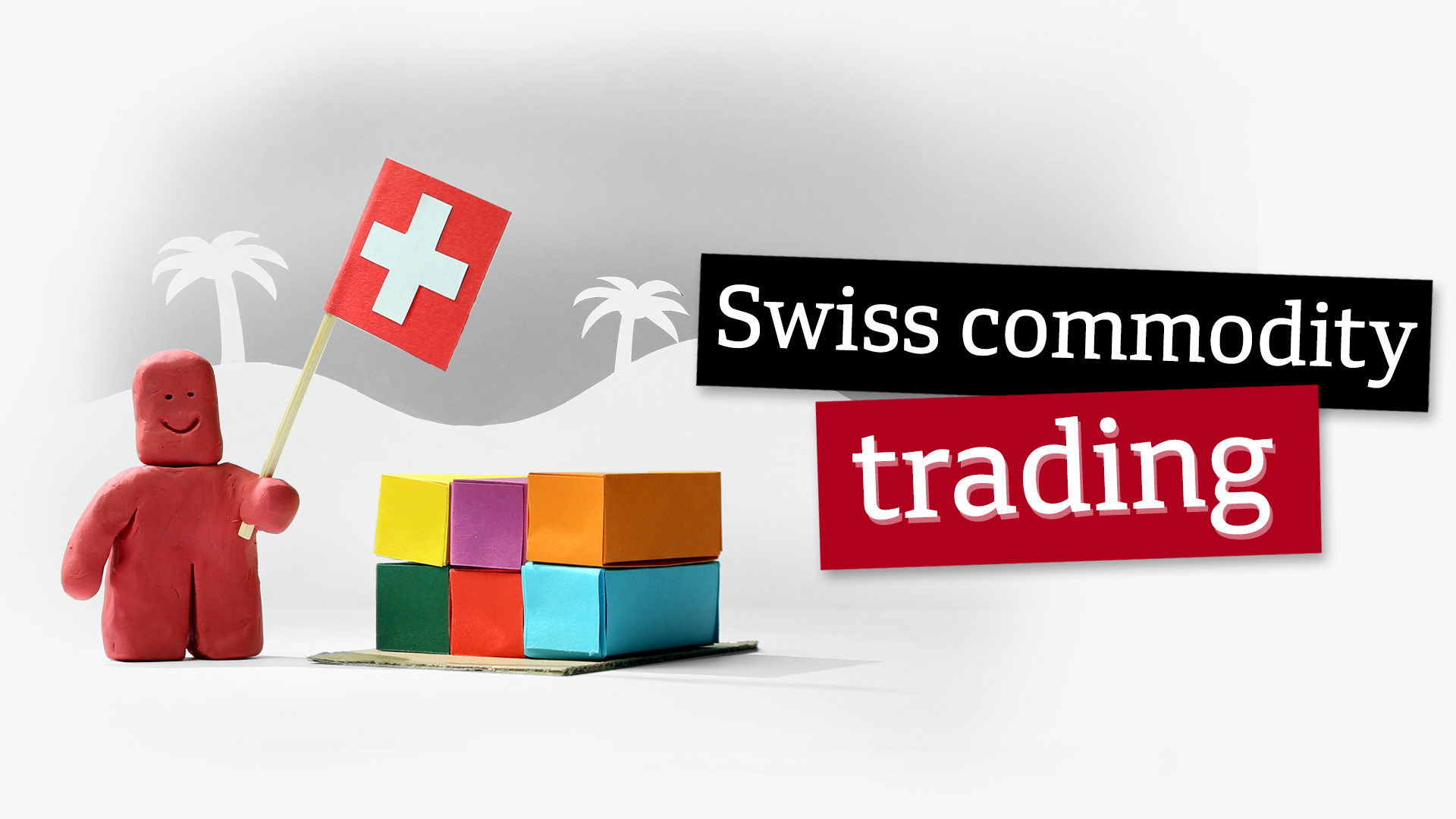 Clay figure holding a Swiss flag in front of paper ship containers